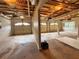 Spacious unfinished garage featuring multiple bays, exposed ceiling beams, and ample storage space at 208 Regency Ct, Acworth, GA 30102