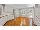 Kitchen with wood floors, white cabinets, and stainless steel appliances at 208 Regency Ct, Acworth, GA 30102
