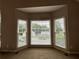 Sunlit living room with large bay window and neutral carpet at 208 Regency Ct, Acworth, GA 30102