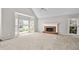 Inviting living room featuring a fireplace, large windows and neutral carpet at 208 Regency Ct, Acworth, GA 30102
