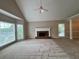 Spacious living room with vaulted ceiling, fireplace, and large windows at 208 Regency Ct, Acworth, GA 30102