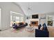 Bright living room with vaulted ceiling, fireplace, large windows and stylish decor at 208 Regency Ct, Acworth, GA 30102