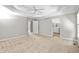 Spacious main bedroom with tray ceilings, ceiling fan and ensuite bathroom access at 208 Regency Ct, Acworth, GA 30102