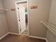 Spacious walk-in closet with neutral paint, door leading to the bathroom, and wire shelving at 208 Regency Ct, Acworth, GA 30102