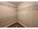 A walk-in closet featuring built-in white wire shelving for optimal storage at 208 Regency Ct, Acworth, GA 30102