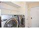 Laundry room with front-loading washer and dryer, offering convenient space for laundry tasks at 3090 Perch Sw Ln, Marietta, GA 30008