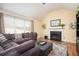 Bright living room with vaulted ceilings, fireplace, and comfortable seating area at 3090 Perch Sw Ln, Marietta, GA 30008