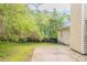 Backyard features a concrete patio and a natural green space at 5888 Old Wellborn Trce, Lithonia, GA 30058