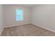 Bedroom with carpet and neutral paint, illuminated by a window at 5888 Old Wellborn Trce, Lithonia, GA 30058