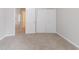 Bedroom with neutral carpeting and a closet, creating a blank canvas for personalization at 5888 Old Wellborn Trce, Lithonia, GA 30058