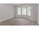 Bedroom featuring a large bay window that provides natural light, showcasing the room's potential at 5888 Old Wellborn Trce, Lithonia, GA 30058