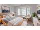 Bright bedroom with a bay window and modern decor, creating a cozy and inviting space at 5888 Old Wellborn Trce, Lithonia, GA 30058