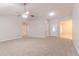 Neutral living room featuring a vaulted ceiling and multiple entry points at 5888 Old Wellborn Trce, Lithonia, GA 30058