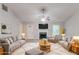 Bright living room with plush rug, fireplace, and neutral-toned furnishings at 5888 Old Wellborn Trce, Lithonia, GA 30058