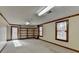 Finished basement with door to exterior and built-in shelving at 617 Rock Springs Rd, Lawrenceville, GA 30043