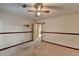 Bedroom featuring a carpet, ceiling fan, and wood trim at 617 Rock Springs Rd, Lawrenceville, GA 30043