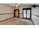 Carpeted bedroom with a large window and closet at 617 Rock Springs Rd, Lawrenceville, GA 30043