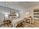Bedroom features wood floors, wood-planked walls, stylish beach-themed art, and a dresser at 617 Rock Springs Rd, Lawrenceville, GA 30043