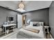 Stylish bedroom featuring gray walls, wood floors, and a large window providing natural light at 617 Rock Springs Rd, Lawrenceville, GA 30043
