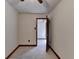 Bedroom with speckled floors and wood trim, door ajar revealing view into other rooms at 617 Rock Springs Rd, Lawrenceville, GA 30043