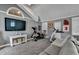 Gray finished bonus room offering exercise equipment, wall-mounted TV and comfortable seating at 617 Rock Springs Rd, Lawrenceville, GA 30043