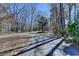 Long driveway leading to the property surrounded by trees at 617 Rock Springs Rd, Lawrenceville, GA 30043