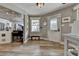 Inviting entryway featuring wood floors, natural light, and a quaint bench at 617 Rock Springs Rd, Lawrenceville, GA 30043