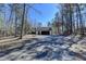 Home's driveway and front yard with a basketball hoop for recreational activities at 617 Rock Springs Rd, Lawrenceville, GA 30043