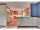Retro kitchen with tile floor, bar, and colorful cabinet space at 617 Rock Springs Rd, Lawrenceville, GA 30043