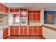 Retro kitchen with red cabinets and white appliances at 617 Rock Springs Rd, Lawrenceville, GA 30043