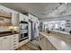 Spacious kitchen featuring white cabinets, stainless steel appliances, and hardwood floors at 617 Rock Springs Rd, Lawrenceville, GA 30043