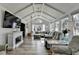 Bright living room with vaulted ceilings, fireplace, and large windows offering scenic views at 617 Rock Springs Rd, Lawrenceville, GA 30043