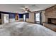 Open living room with carpet, fireplace, and built in shelves at 617 Rock Springs Rd, Lawrenceville, GA 30043