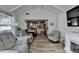 Open concept living room flowing into the kitchen, featuring hardwood floors and a fireplace at 617 Rock Springs Rd, Lawrenceville, GA 30043