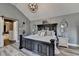 Spacious main bedroom featuring a large bed, modern lighting, and an ensuite bathroom at 617 Rock Springs Rd, Lawrenceville, GA 30043