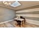 Bright office featuring stylish stripe design, modern lighting, and wood floors at 617 Rock Springs Rd, Lawrenceville, GA 30043