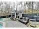 A backyard pool area with patio seating and a pool house, perfect for outdoor entertaining at 617 Rock Springs Rd, Lawrenceville, GA 30043