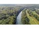 Aerial view showcasing the river, golf course, and surrounding lush, green landscape at 760 River Gate Dr, Atlanta, GA 30350