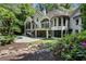 Spacious backyard with pool, landscaped gardens, patio and second-story balconies at 760 River Gate Dr, Atlanta, GA 30350