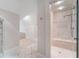 A bright bathroom showcases a tiled shower with a built-in seat and a glass door at 760 River Gate Dr, Atlanta, GA 30350