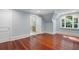A bedroom reveals gleaming hardwood floors, a bright window, and an ensuite bath at 760 River Gate Dr, Atlanta, GA 30350