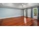 Spacious bedroom featuring hardwood floors and French doors leading to outdoor space at 760 River Gate Dr, Atlanta, GA 30350