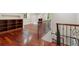 The bonus room features hardwood floors, built in shelving and wrought iron railing at 760 River Gate Dr, Atlanta, GA 30350