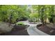 Long, winding driveway leading to the house through a lush, wooded landscape at 760 River Gate Dr, Atlanta, GA 30350