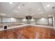 Mirrored exercise room featuring hardwood floors, barres, and a wall-mounted television at 760 River Gate Dr, Atlanta, GA 30350