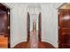Elegant hallway with arched doorways and hardwood floors at 760 River Gate Dr, Atlanta, GA 30350