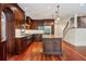 Bright kitchen featuring custom cabinets, stainless appliances, hardwood floors and large island at 760 River Gate Dr, Atlanta, GA 30350