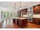 Gourmet kitchen features custom cabinetry, stainless steel appliances, and a large center island at 760 River Gate Dr, Atlanta, GA 30350