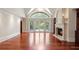 Spacious living room with a vaulted ceiling, fireplace, and large windows for natural light at 760 River Gate Dr, Atlanta, GA 30350