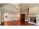 Spacious living room with hardwood floors, fireplace, and elegant chandelier at 760 River Gate Dr, Atlanta, GA 30350